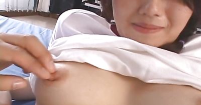 Beautiful Sae Mizuki is kneeling in front of pussy tester and sucking his donga